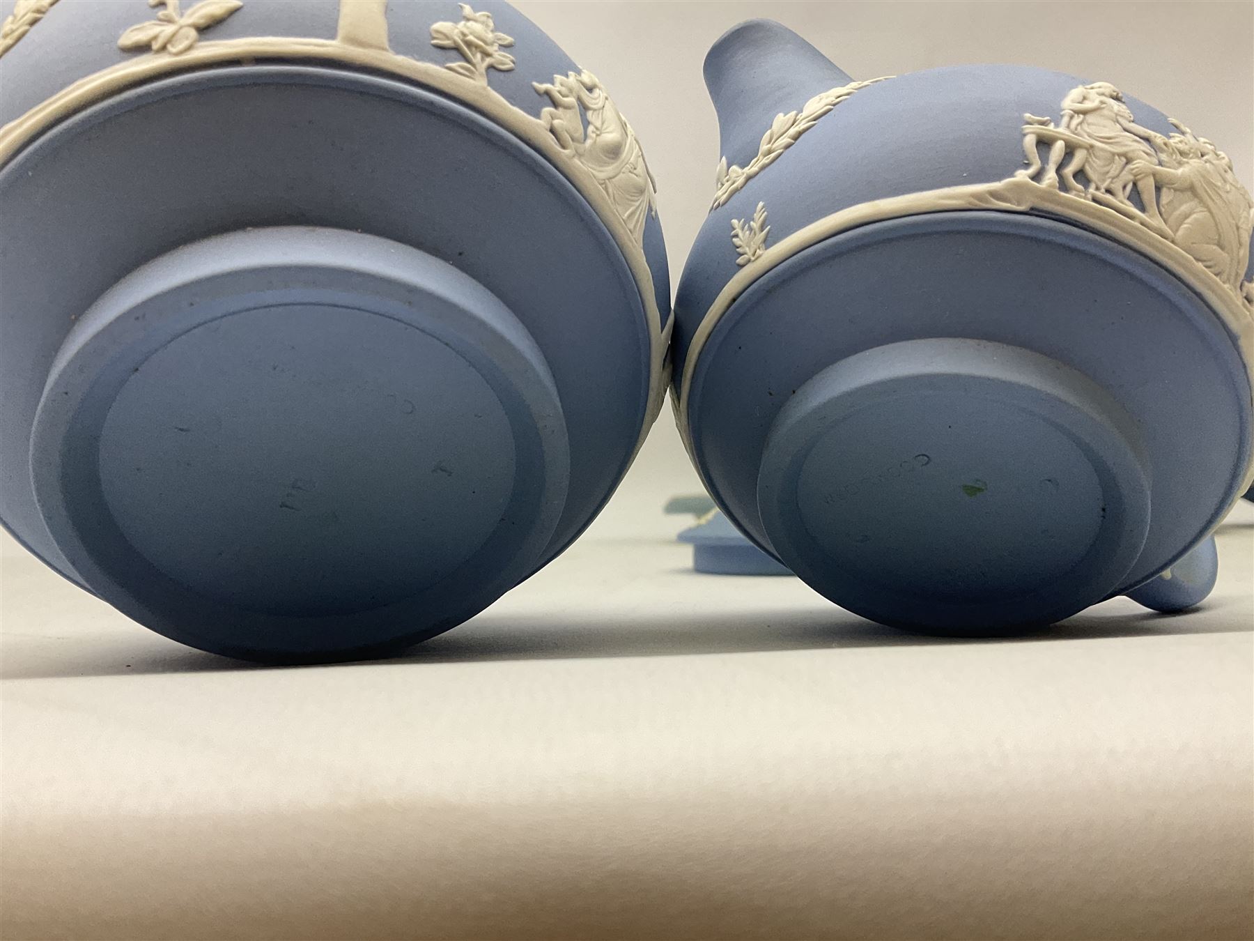 Late 19th century pale blue Wedgwood Jasperware cheese dome with cover, decorated with acorn and oak leaf bands surrounding neo-classical ladies, cherubs, flowers and trees, impressed Wedgwood mark beneath, together with further Wedgwood Jasperware teapots, boxed dishes etc