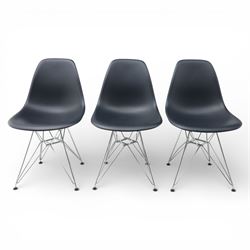 Vitra - set of six DSR side chairs designed by Charles and Ray Eames, moulded black plastic seats, raised on chromed wire Eiffel bases with plastic foot glides