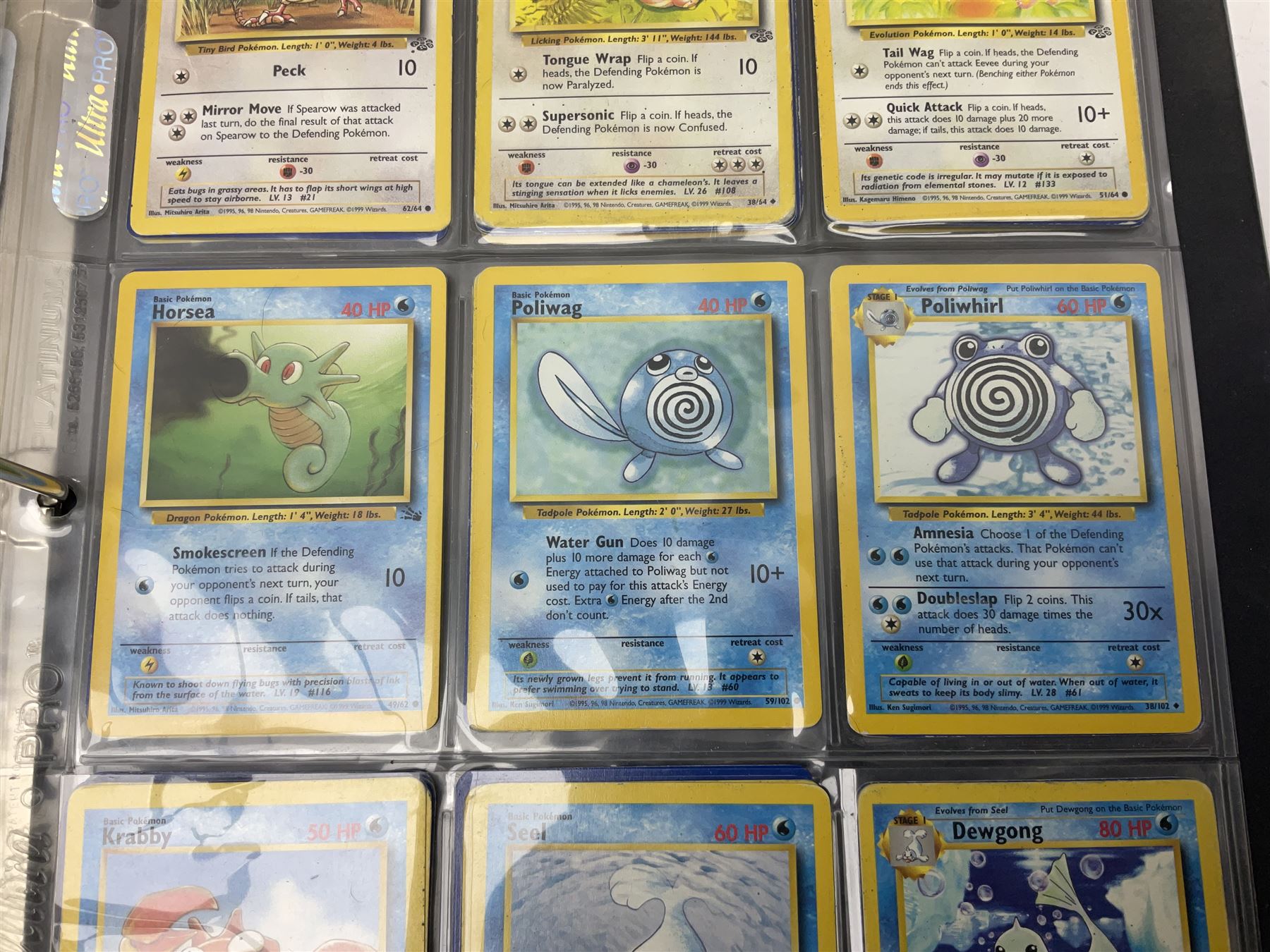 Collection of Pokemon trading cards, mostly 1999 Wizards Pokemon cards to include holo Charizard 4/102, first edition holo Machamp 8/102, further holographic cards; Dark Flareon 35/82 and Dark Vaporeon 45/82, cards from themed sets and 4th edition prints; 1998 Electronic Pokédex with cardboard boxes for themed decks Blackout, Overgrowth and Power Reserve Jungle, along with a large quantity of energy and trainer cards 