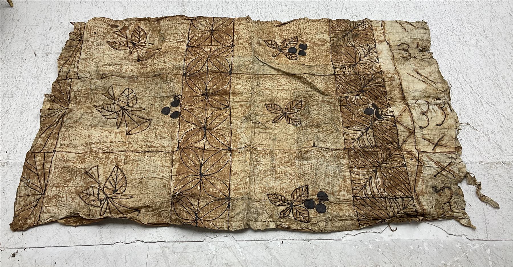 Collection of traditional necklaces from the Solomon Islands, including shell and boar tusk examples, together with a carved canoe prow, with mother of pearl eyes, painted cow hide and a copper plaque, depicting the Solomon Islands, with presentation engraving