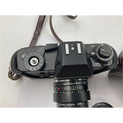 Leitz Leicaflex SL2 camera body, serial no.1387046, with 'Summicron-R 1:2/50 Leitz Wetzlar' lens, serial no. 2273397, within a leather Leitz lens hood 