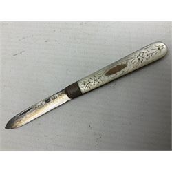 Silver mounted dressing table mirror, embossed with birds, masks, and foliate and C scrolls, hallmarked Birmingham, and fruit knife with mother of pearl handle and silver blade, (2)