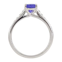 18ct white gold oval tanzanite ring, with channel set round brilliant cut diamond shoulders, stamped 750, tanzanite approx 0.85 carat