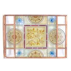 Two stained glass leaded panels each decorated with birds in foliate to to the centre, together with another panel with a female figure to the central panel, largest L78cm, H53cm