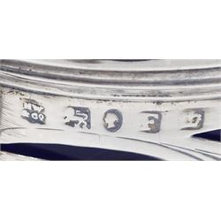 Victorian silver mustard pot, of drum form with scroll handle and scrolling foliate pierced decoration, the body with cartouche engraved with initial and date of 1843, upon an ogee baton and ball foot, hallmarked Henry Wilkinson & Co, Sheffield 1849, with accompanying blue glass liner, H8cm, approximate silver weight 3.57 ozt (111.3 grams)
