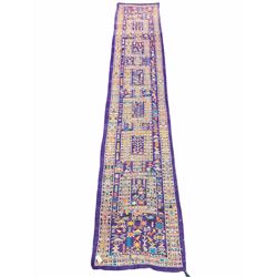 Flat weave violet ground runner, the field set with six panelled and decorated all over with stylised animal and plant motifs, the outer band decorated with repeating geometric design 