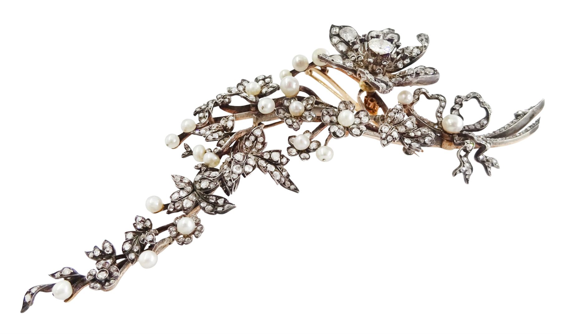 19th century gold and silver diamond and pearl en tremblant detachable brooch, the flower tremblant with a principal old cut diamond of approx 1.90 carat, the petals and stamen set with old cut and rose cut diamonds, total diamond weight approx 9.10 carat, to a foliate spray set set with further rose cut diamond and white / pink / cream pearls and ribbon tie