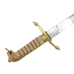 George V midshipman`s dirk, the 45cm straight single edged blade, length etched with crowned GRV cypher and anchor foliate scrolls, gilded brass hilt with lion`s head pommel and wirebound fishskin covered grip, in brass mounted leather sheath, the upper mount engraved  'C.R.B', with a cord and wire knife knot, overall L6cm` 