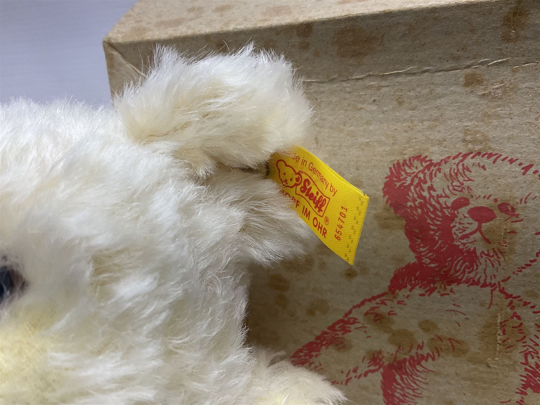 Modern Steiff teddy bear - The Millenium Bear No.34709 with golden pendant H32cm; in original box with paperwork; together with a Steiff ball-point pen in case sent to the vendor as compensation for a delay in receiving the bear.