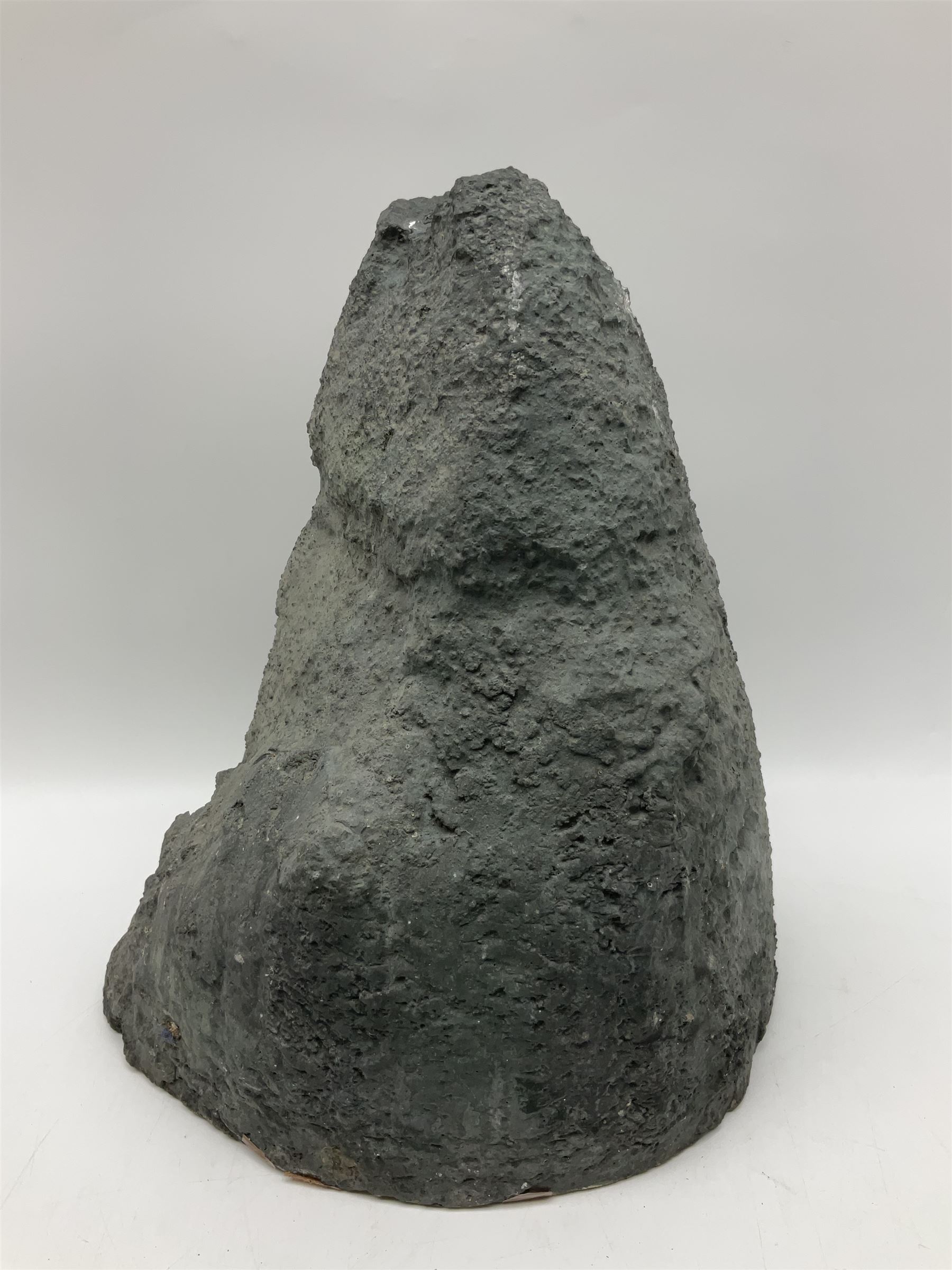 Amethyst crystal ‘cathedral’ geode, free standing with flat base and prepared outer surface, with well-defined crystals of various sizes within the cavern, H39, L32cm