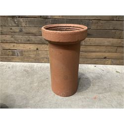 Cast iron cauldron set pot with 2 terracotta chimney pots and 2 terracotta planters,