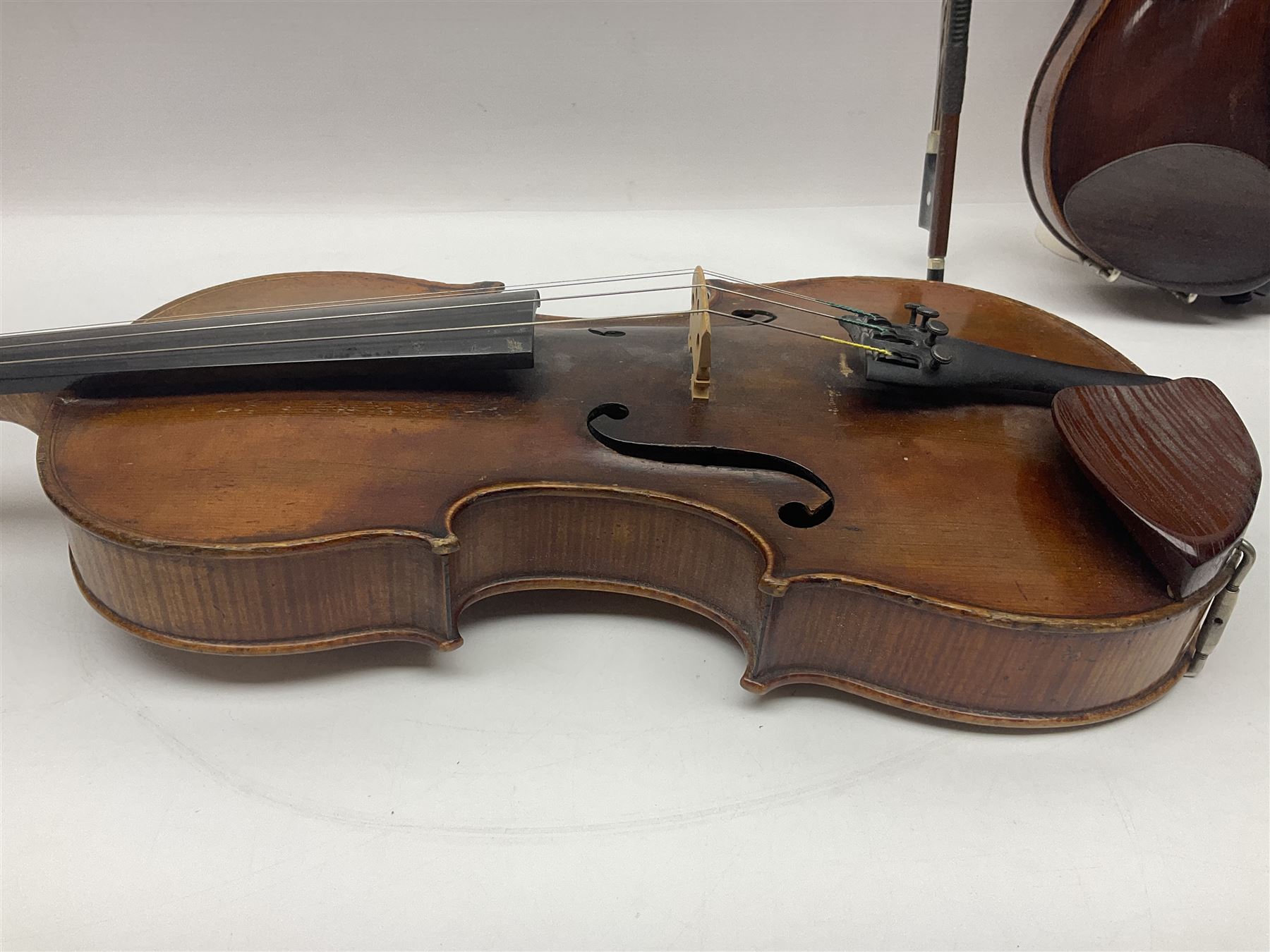 German trade violin in the Steiner style c1900 with 35.5cm two-piece maple back and ribs and spruce top L59cm overall; in fitted carrying case with two bows; and a Saxony violin with 35.5cm one-piece maple back and ribs and spruce top L58.5cm overall (2)