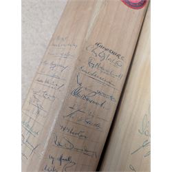 Two signed cricket bats, with signatures including Colin Cowdrey