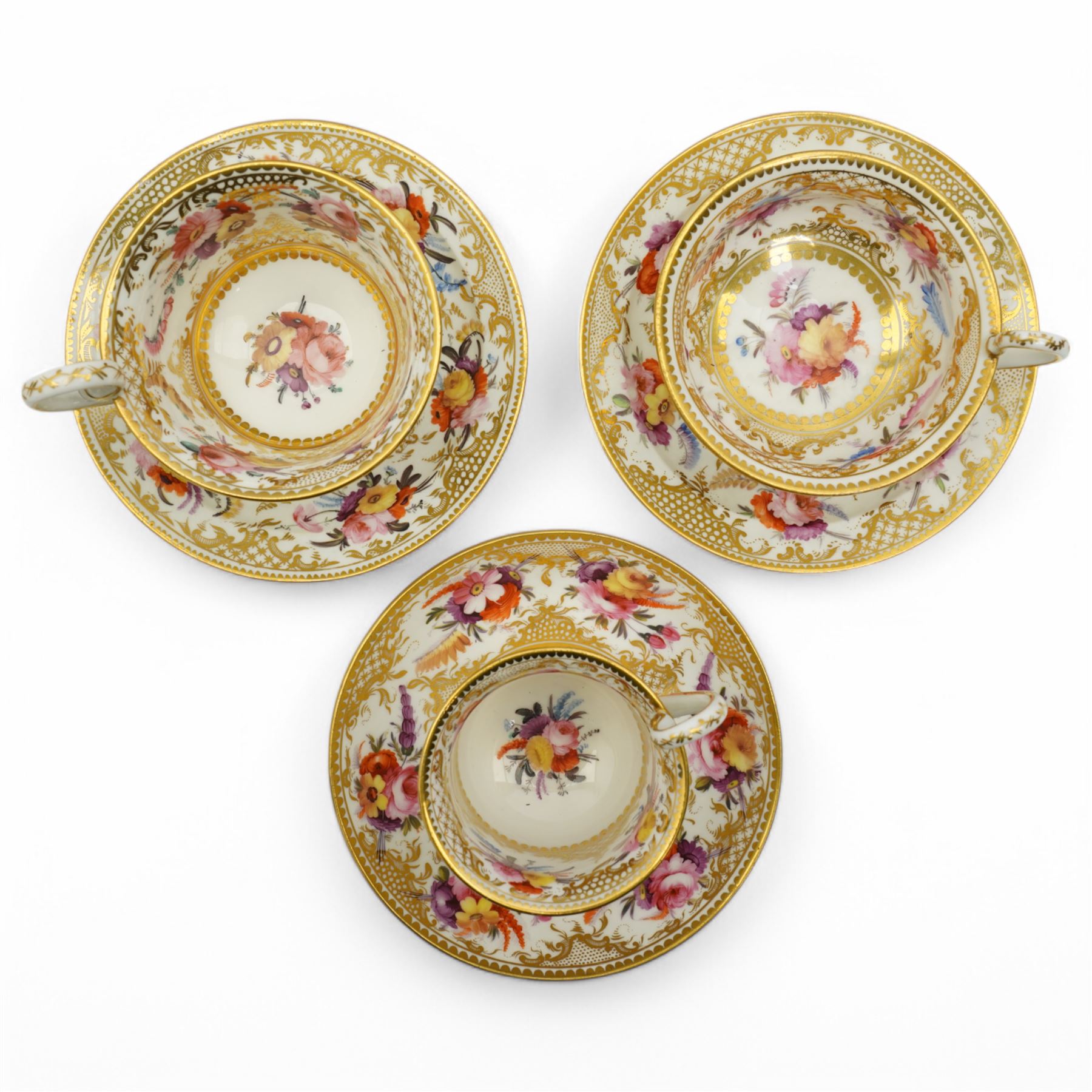 Coalport tea and coffee cups, pattern no. 830, decorated with sprays of flowers within gilt borders, comprising three teacups, four coffee cups and five saucers, with another matched teacup and saucer 