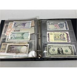 World banknotes, including Queen Elizabeth II The States of Jersey one pound 'DB202703', five pounds 'BB527762' and ten pounds 'AB651481', reserve bank of New Zealand two dollars '1L3 741894', King George V Straits Settlements one dollar 1st January 1935 'F/83 28924', various Bank of England notes etc, housed in two ring binder albums