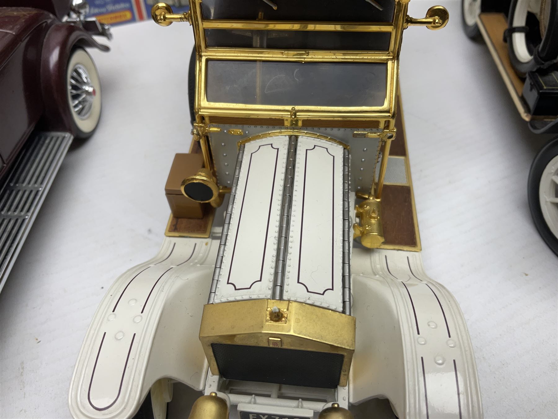 Four Franklin Mint 1:24 scale model cars, to include 1940 Duesenberg, 1912 Packard Victoria, 1935 Duesenberg and 1911 Rolls Royce, together with other diecast vehicles including Matchbox Models of Yesteryear, Lledo etc