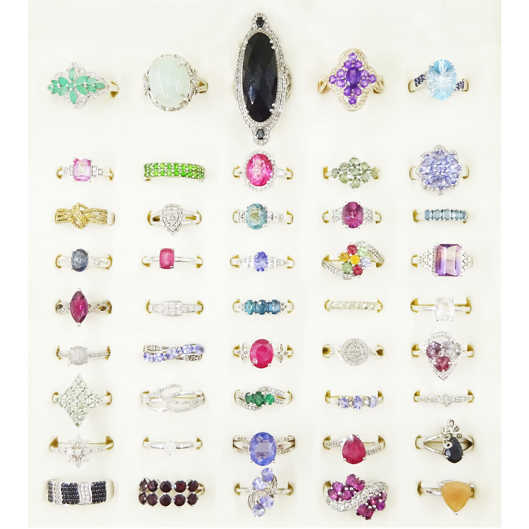 Forty-five silver stone set rings including amethyst, garnet, diamond, topaz, ametrine, ruby tanzanite and garnet