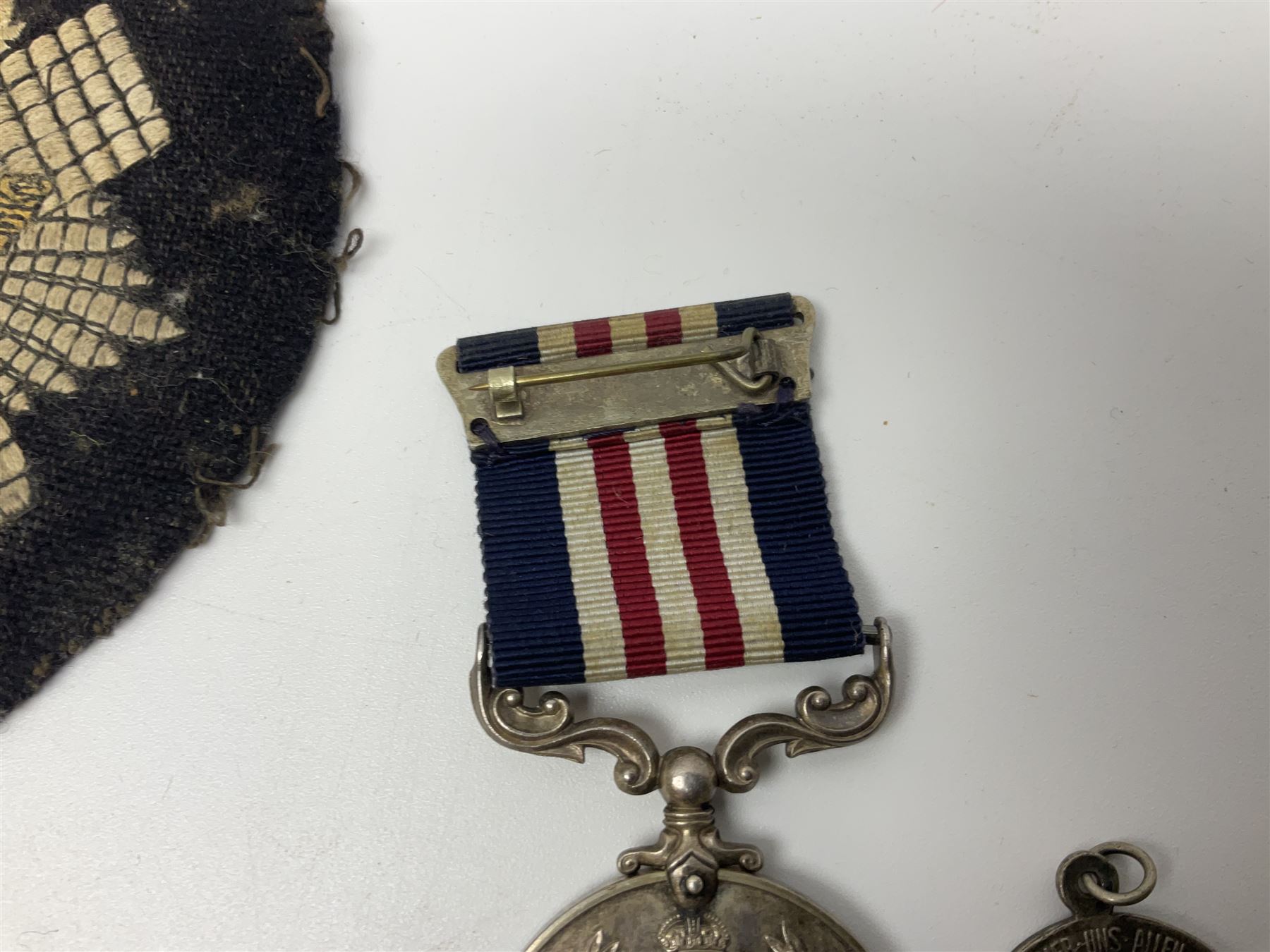 WW2 Highland Light Infantry Military Medal group of five comprising MM, 1939-1945 War Medal, Defence Medal, 1939-1945 Star and France and Germany Star; three with ribbons; awarded to 1702538 A. Sjt. A.L. Alden H.L.I.; various copies of his citation giving details of his bravery on 26 Sep 44 at Donderdonk France when he single-handedly silenced an enemy machine gun nest. The citation also mentions a further heroic act on 15 Nov 44 when he risked his life to obtain vital information on the position of enemy mines and booby traps saving the lives of many other soldiers; the collection also comes with two contemporary group photographs of his Highland Light Infantry regiment, copy photograph of him being awarded the MM by Field-Marshall Montgomery, two post-war tug-o-war medallions and other items; together with a shooting medallion awarded to Gnr. J. Alden (his brother John) inscribed 123 L.A.A. Regt. R.A. Rifle Meeting Harburg 1945 and a Life Saving bronze medallion to J. Alden April 1938
