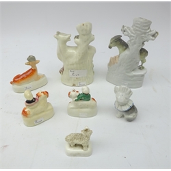  Victorian Staffordshire animals comprising Donkey spill vase, Cow with Milk Maid, Girl and Boy seated on Spaniels, Frit work sheep, recumbent Deer and 19th century ceramic model of a Cat in a bonnet, H16cm max (7)  
