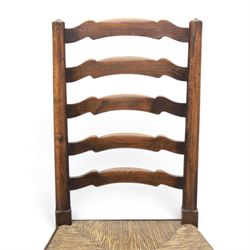 19th century set of six ash and elm ladderback dining chairs, shaped ladder backs above rush seats, raised on turned front supports with pad feet, united by turned stretchers