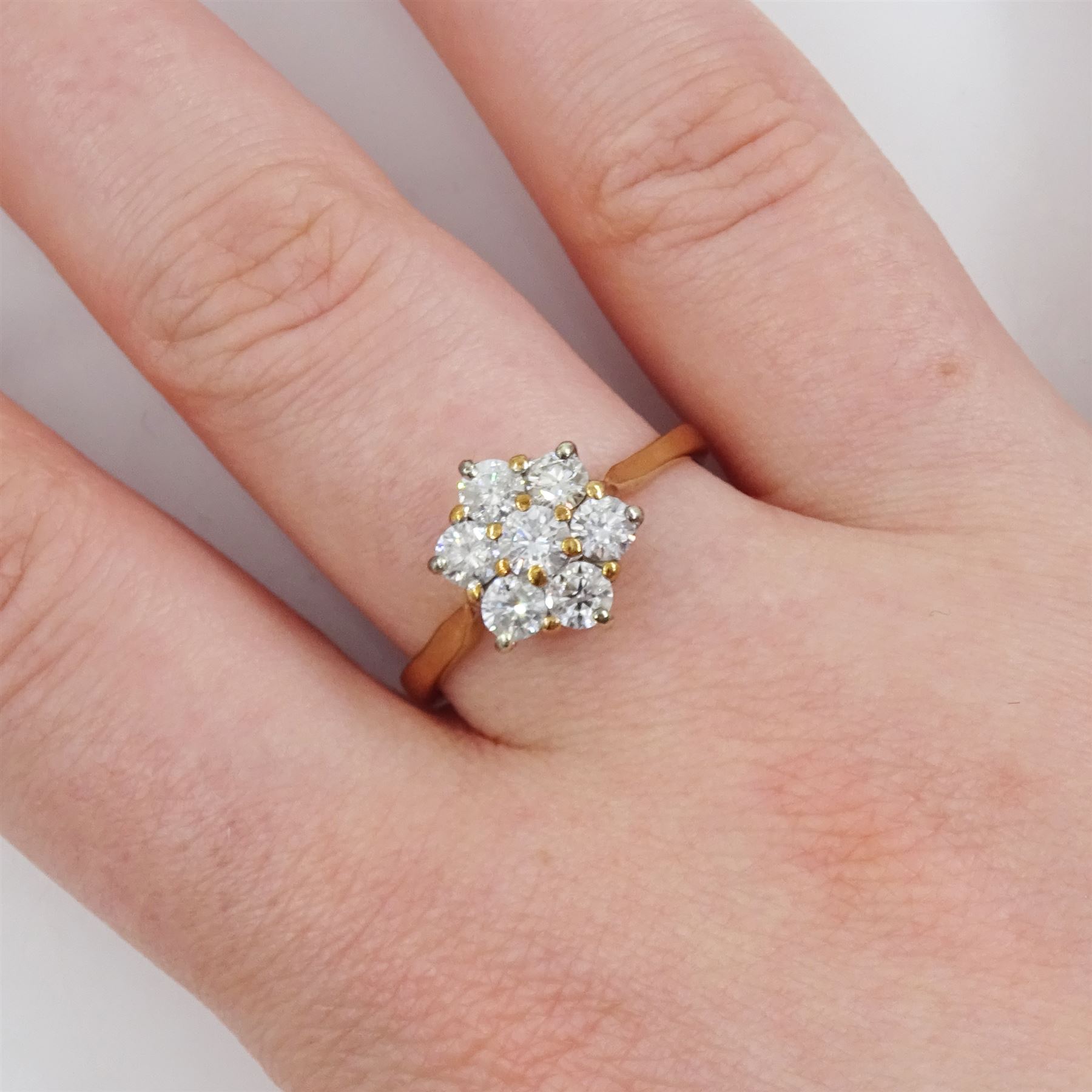 9ct rose gold seven stone round brilliant cut diamond, flower head cluster ring, total diamond weight approx 1.05 carat