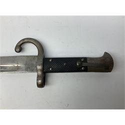 Turkish Model 1874 sword bayonet with 57.5cm curving steel fullered blade and chequered black grip, in steel mounted leather scabbard L75.5cm overall
