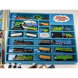 Thomas The Tank Engine and Friends - over forty unboxed models and figures by ERTL with moulded plastic wall mounting display rack; Hornby Clockwork Train Set; and Tomy Big Fun Jig-Saw Play Train; both boxed