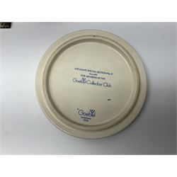 Two ceramic Hummel postcards by Goebel, both displayed on wooden easels, together nine Hummel eggs, set of four Hummel School Days plates, on wooden hanging rack, Goebel Collectors Club Member plaque etc