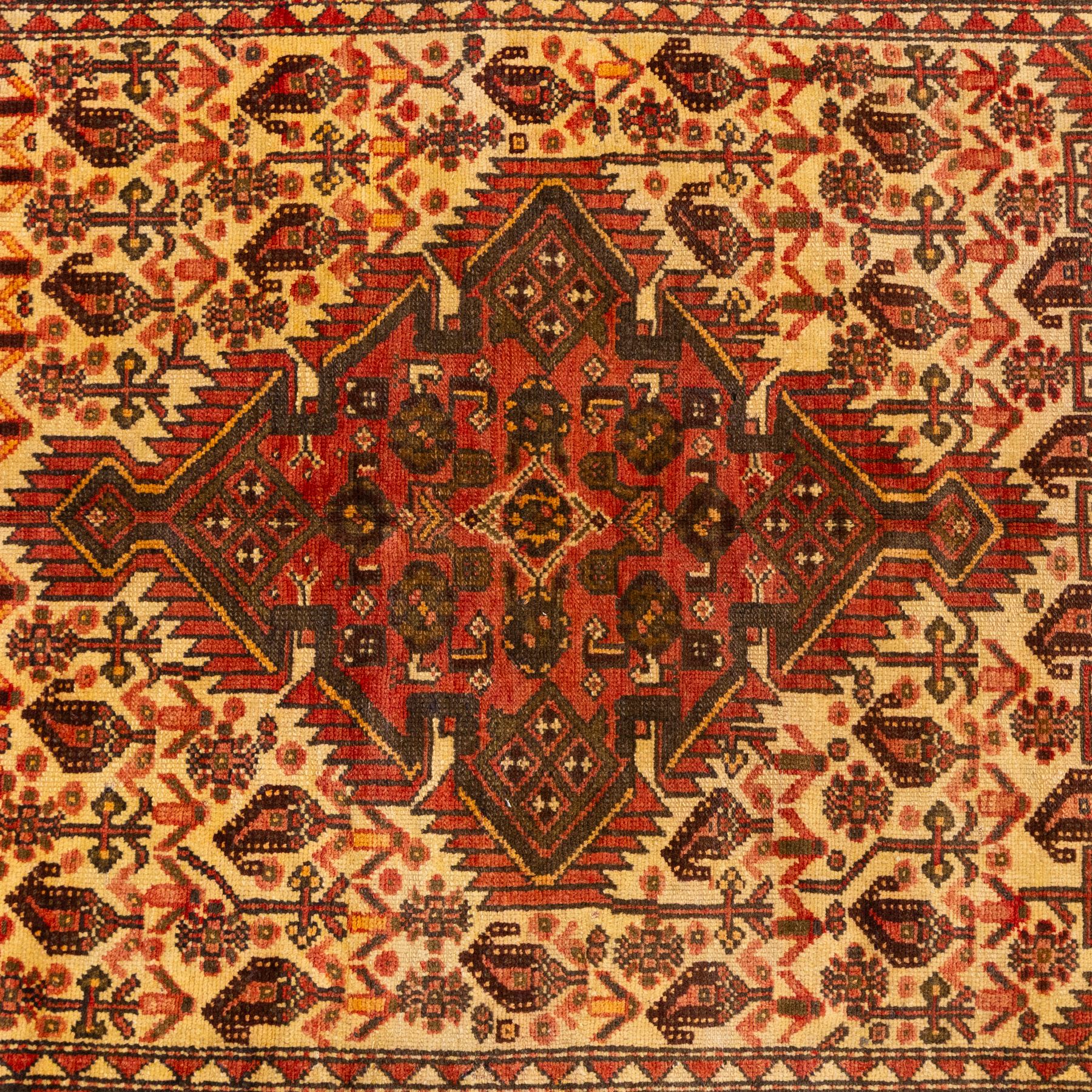 North West Persian Malayer hand-knotted rug, ivory field with central stepped lozenge medallion with angular pendants, surrounded by rows of stylized boteh and geometric floral devices within multiple geometric and stylized vine borders, with fringe ends