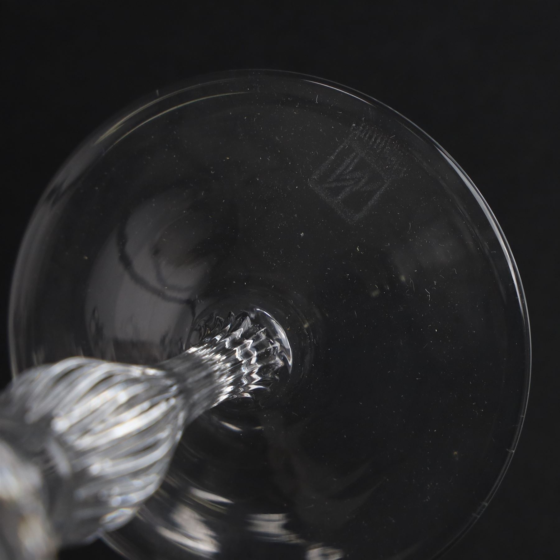 Set of six Murano clear glass wine glasses, each with part moulded fluted flared bowl, upon a knopped and fluted baluster stem and spreading circular foot, with etched marks beneath, H19.5cm