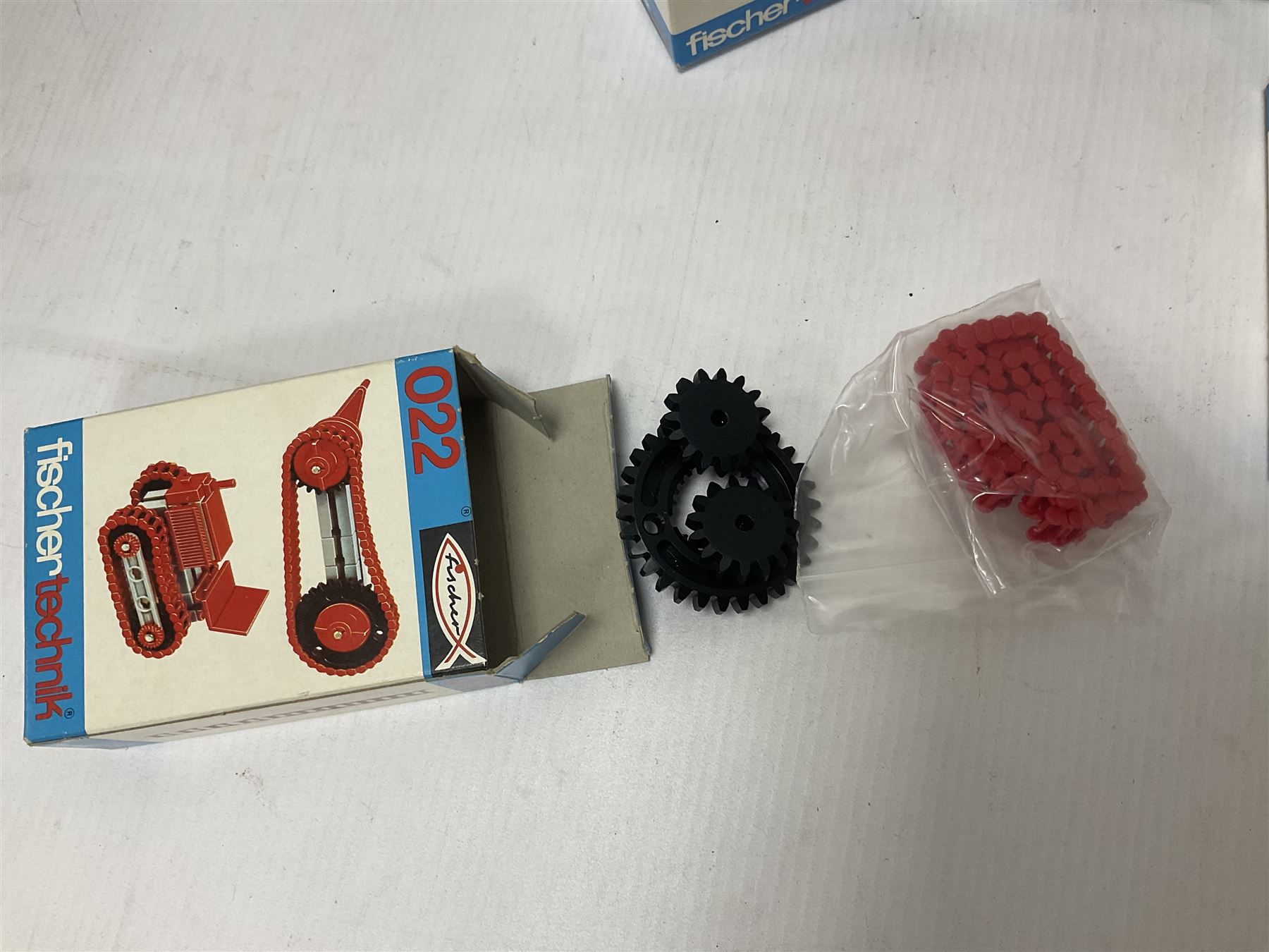 Fischer Technik/Lego/Playmobil - thirteen model building sets comprising eight Fischer Technik sets 50, 50/1, 50v, 50/2, 50+mot1 and two 50S, 50/1 add-on pack, with spare parts packs 01, 03, 05, two 22 and 30; two Lego sets comprising C107 and Lego Systems 103, part-set 870 and 970; Playmobil no.3520 set; four boxes of loose lego, various instruction manuals and a scrapbook 