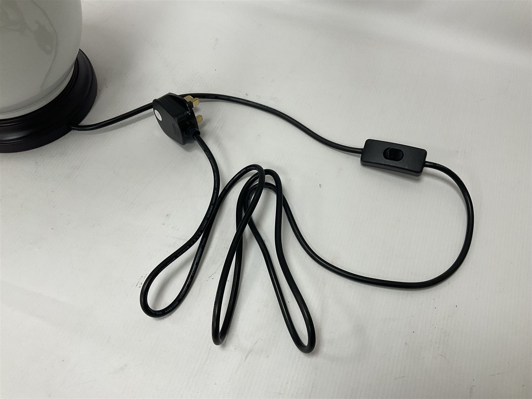 Pair of Chinese ivory crackle glazed table lamps, each of bottle form, raised upon circular hardwood base, excluding fittings H43cm