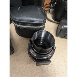 Kodak Dakon II folding camera and a collection of camera lenses and accessories, including Reflex-Nikkor  1:8 f=500mm, NikoN AF Nikkor 70-300mm 1:4-5.6G, Micro TM monocular lens and Teleshot adapter, two cases, Weston exposure meter, two cases etc