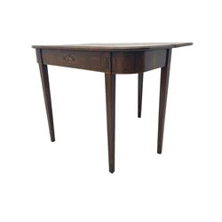 Regency mahogany tea table with fold-over top, the frieze with central inlaid panel depicting the British lion with shield, the lower edge with feather-banding, raised on square tapering supports with ebony and satinwood inlays