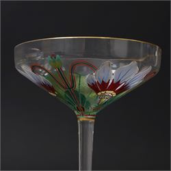 Pair of early 20th century Theresienthal Art Nouveau hand painted glass champagne coupes, the bowls hand painted with flowers, the bowl and foot rims lined in gilt, H13.5cm