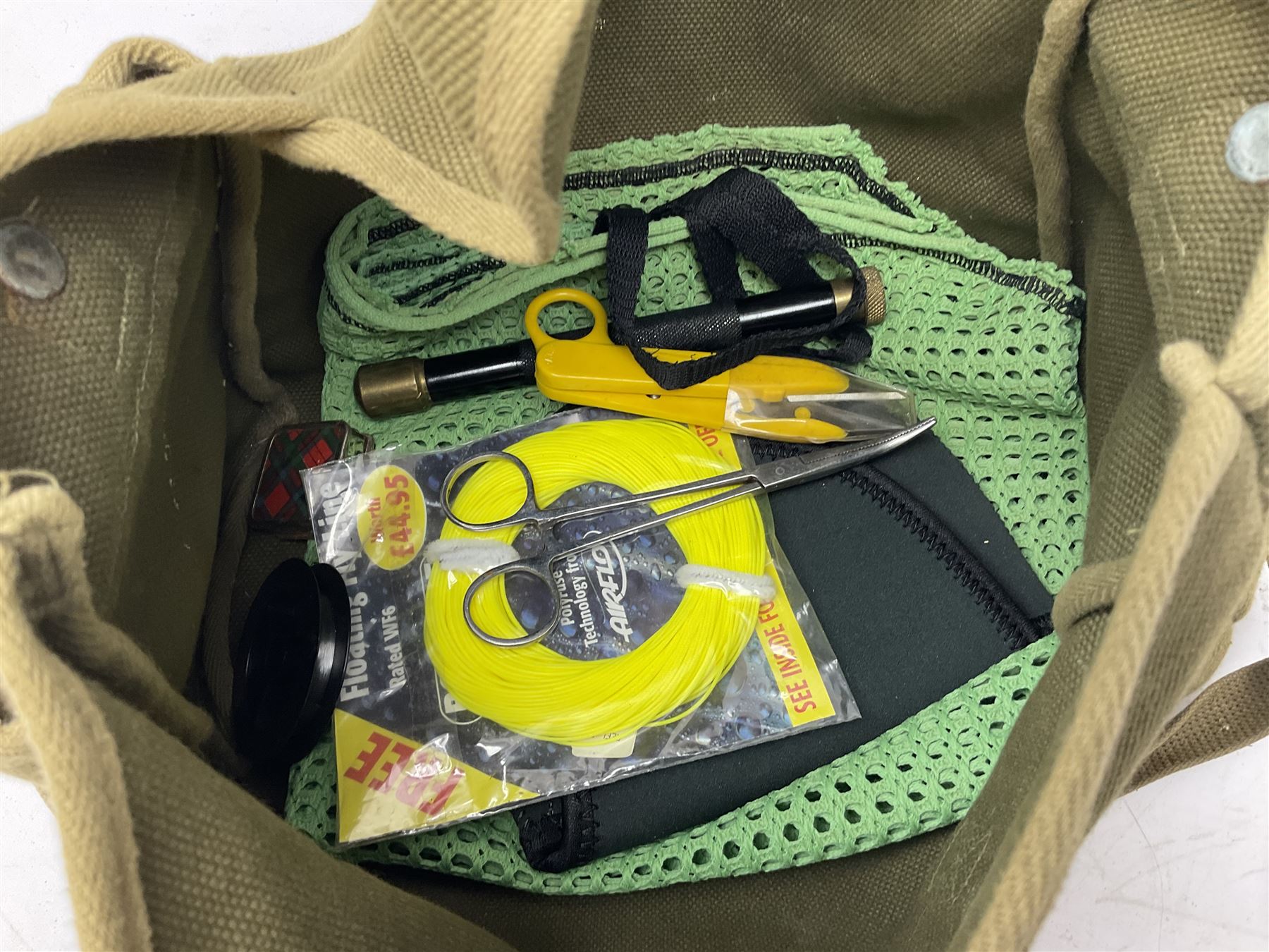 Fishing tackle, including 'The Gnat' fly reel, Alvey 4 1/2 inch reel, Paramount 4 1/2 inch reel, other fishing reels, various fishing flies and other similar items in a carry bag 