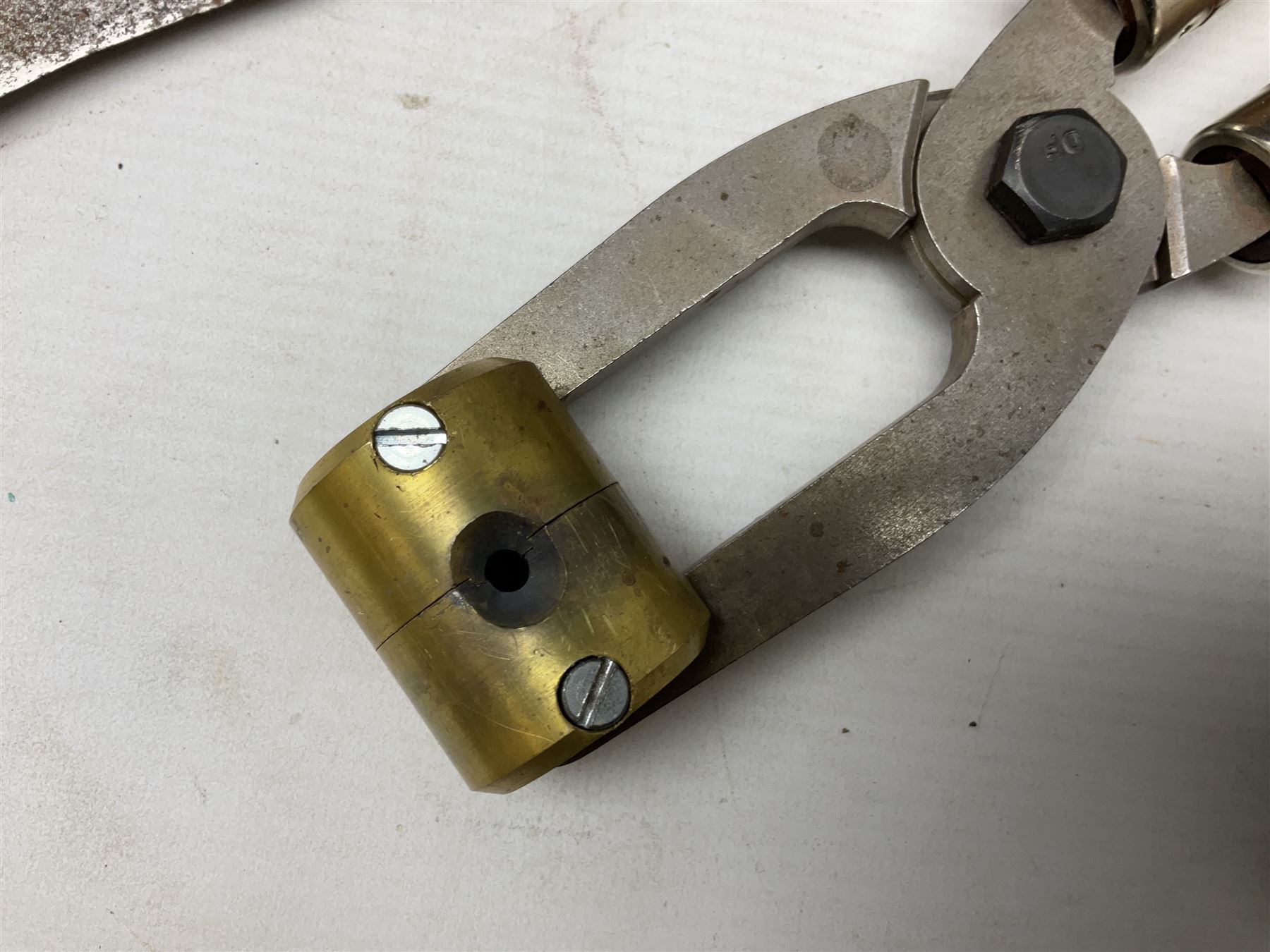 Assorted militaria including ten leather or canvas cartridge and other belts, maroon beret with 17th Lancers cap badge, modern bullet mould, leather and brass shot flask, two knives, shell cases, boomerang etc; in tin deed box