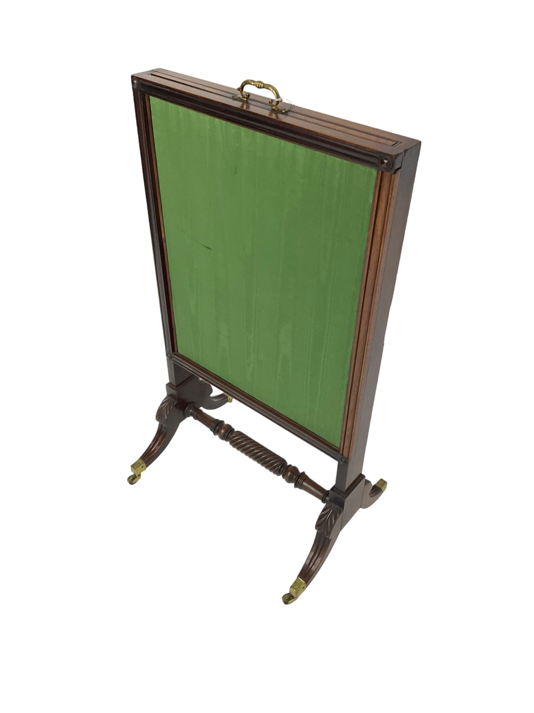 Regency mahogany screen with two horizontal and one vertical pull-out panels, on base with carved sabre legs and rope-twist stretcher