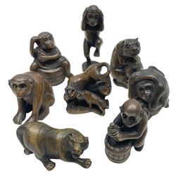 Eight netsuke, modelled as monkeys and tigers