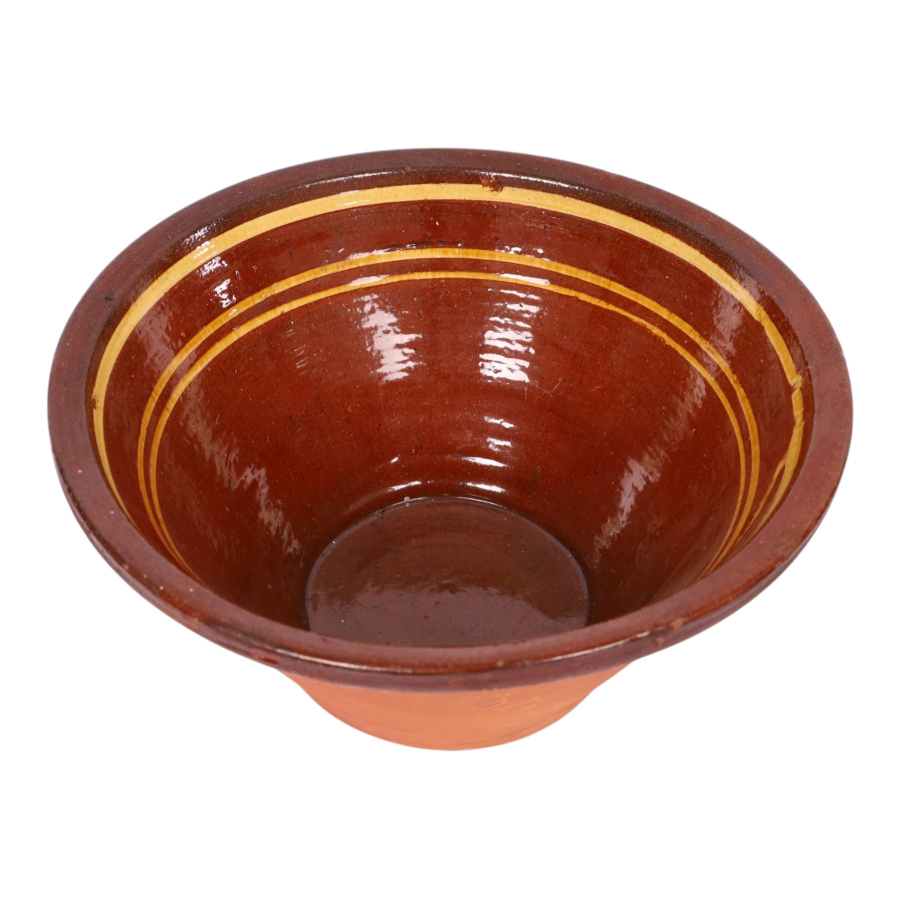 19th century terracotta bread pancheon, of circular form, the glazed interior with slip decoration, H21cm, D43cm