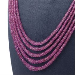 18ct gold pink sapphire necklace, five graduating stands of faceted pink sapphires, with an 18ct gold clasp, London 2004
