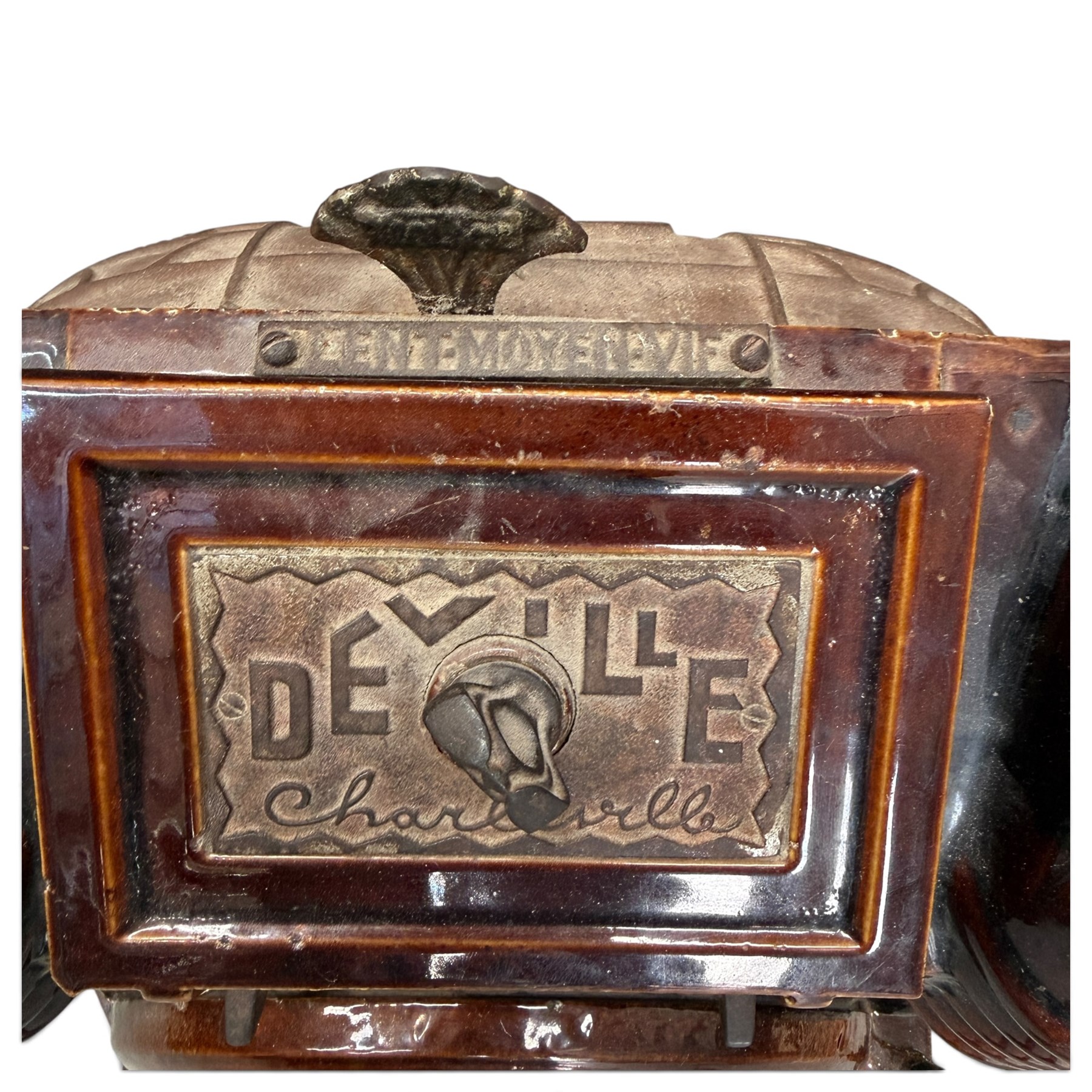 Deville & Cie of Charleville - early 20th century Art Deco cast iron and burgundy enamel 'Cristal' wood burning stove, hinged vent over lattice glazed door and ash drawer, on shaped geometric base, circa 1920