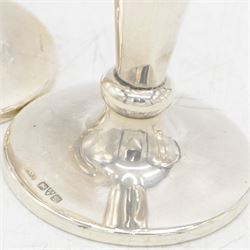 Two pairs of early 20th century silver vases, comprising pair of Edwardian trumpet vases with fluted rims upon a circular domed foot, hallmarked S Blanckensee & Son Ltd, Chester 1907, and a smaller 1920s pair, hallmarked Chester 1920, maker's mark worn and indistinct, tallest H19cm