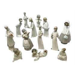 Five Lladro figures, comprising, angel praying, no 4538, angel laying down, no 4541, angel thinking, no 4539, girl with candle, no 4868, and boy kissing no 4869, together with six other similar figures 