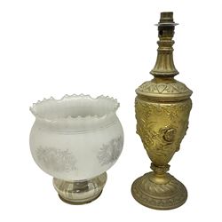 Gilt metal table lamp, heavily embossed with flowers and butterflies, with fluted frosted glass shade, H56cm