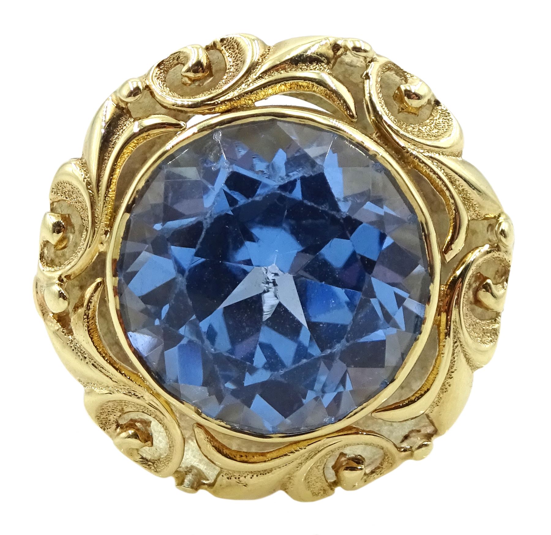 18ct gold single stone round synthetic blue spinel ring, with pierced leaf border