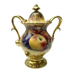Coalport pot pourri vase with twin gilt handles, hand painted by Richard Budd with a study of fruit upon a mossy ground, signed, with printed marks beneath, H14.5cm