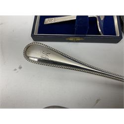Cased pair of Wedgwood silver-plate book stands, silver-plate baby feeding spoon and pusher in box, other silver-plated cutlery