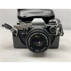 Olympus OM10 35mm camera, cased; pair of USSR 7 x 50 binoculars; cased; and pair of Le Jockey Club Paris binoculars
