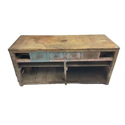 Early 20th century rustic pine workman's bench, rectangular top over four blue painted drawers, under-tier to base, raised on stile supports